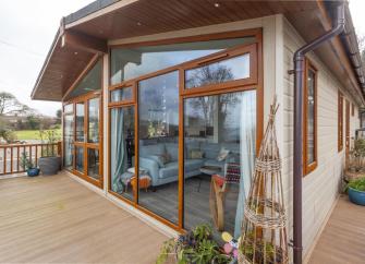 Wood and glass panelled exterior of a luxury Watchet holiday cottage