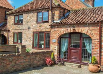 Two-storey brick exterior of a holiday home in Beverley