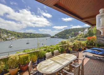 A view of Dartmouth estuary seen from the covered terrace of a waterside holiday let