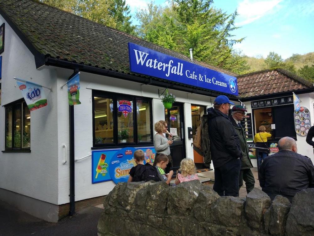 ice cream parlour shop front in a walled garden.