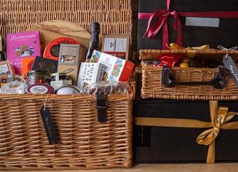 2 wicker baskets displaying packages of organic food.