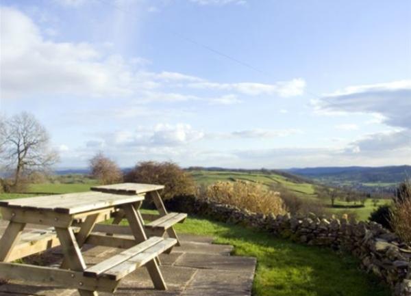  picnic terrace in a low-walled garden with far reaching countryside views.