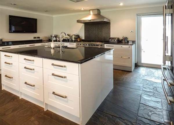 Bespoke fitted kitchen with marble-topped units.
