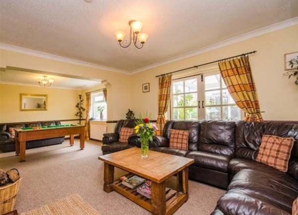 Lounge with wraparound sofa and coffee table
