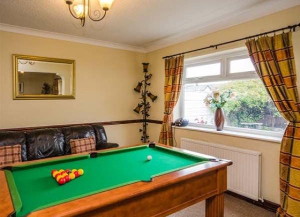Pool table and sofa.