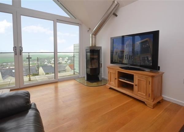 Lounge with floor-to-ceiling windows and far-reaching South Devon rural views.