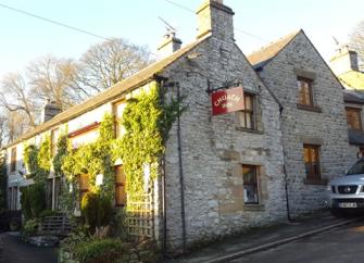 Derby Cottage, a stone-built, ivy-clad Peak District holiday cottage.
