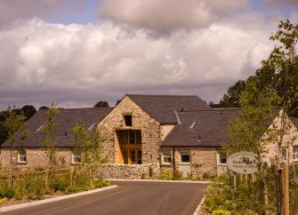 Peak District, stone-built farmhouse and garden.