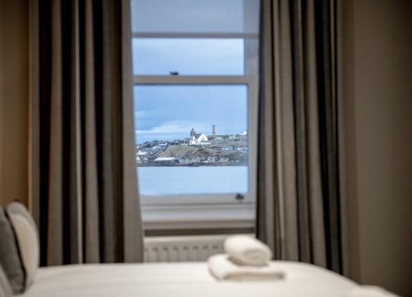 Sea views seen through a bedroom window.