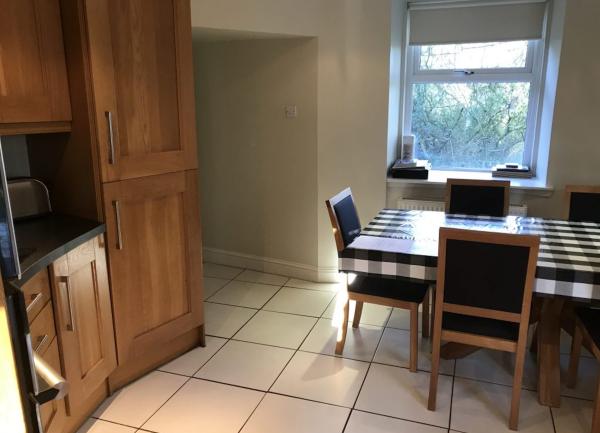 Dining table and chairs in a kitchen.