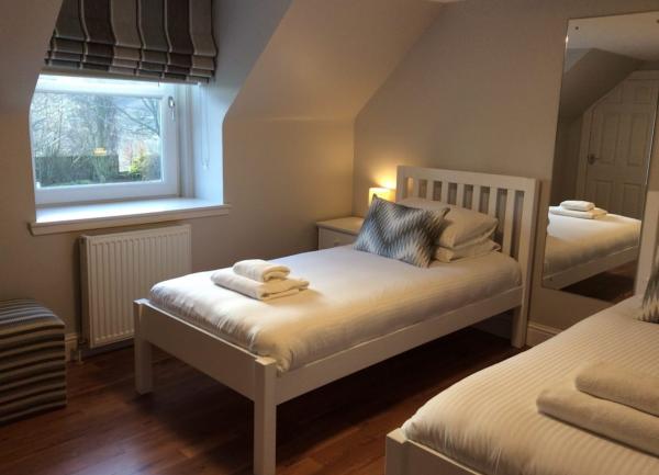 Twin bedroom with beds and full length all mirror.