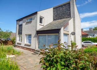 Exterior of a large, detached two-storey Berwickshire holiday let overlooking a large drive and garden.