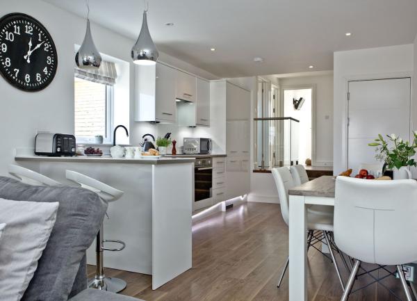 Kitchen-diner with dining table and fitted units.