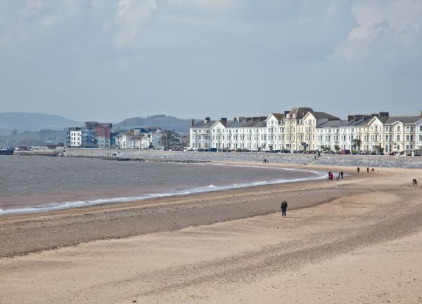 Exmouth beach at low tide lined by Victorian hotels at
