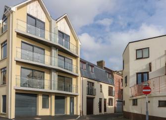 4-storey exterior of contemporary harbourside apartments in Weymouth.