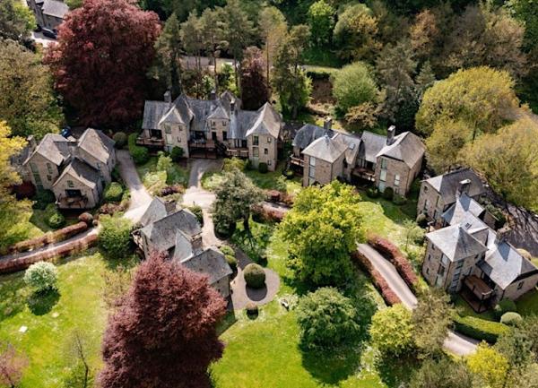 An aerial view of Bovey House holiday cottages in a rural garden setting.