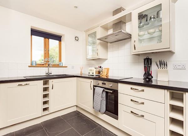 Smart kitchen with fitted cupboards and drawers.