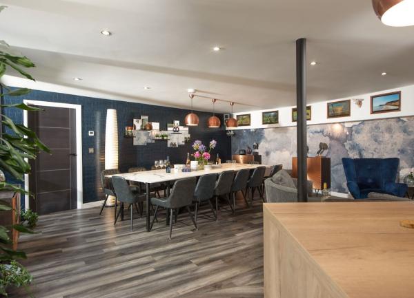 Openplan living view of kitchen, lounge and dining areas.