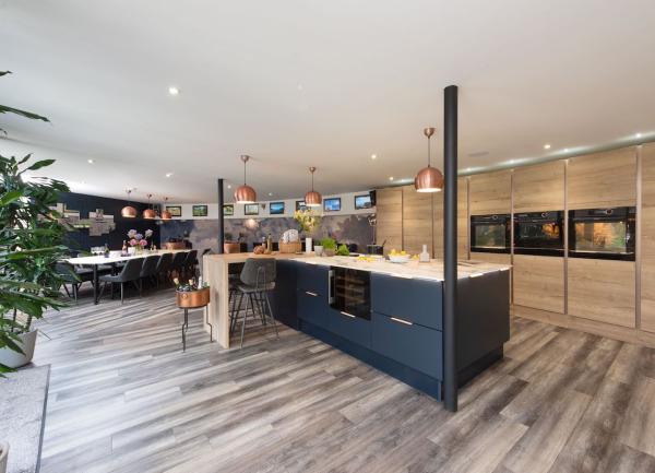 A spacious, contemporary kitchen at Woolbrook Reservoir with a large cooks island and fitted units