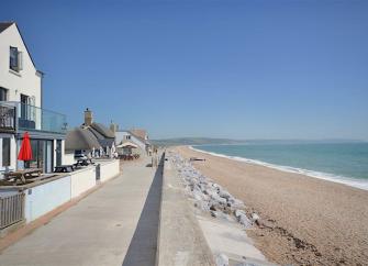 A holiday apartment overlooks a long sandy beach in South Devon.