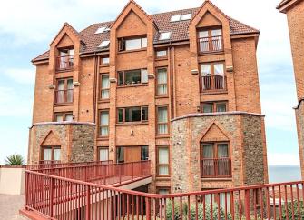 Exterior of a 5-storey brick built block of seaside holiday apartments in North Devon.