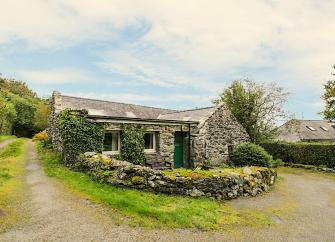 Nestling into a bend on a remote country lane this Gwynedd rural retreat is a single-storey barn conversion.torey barn conversion nestles into a bend in a country lane