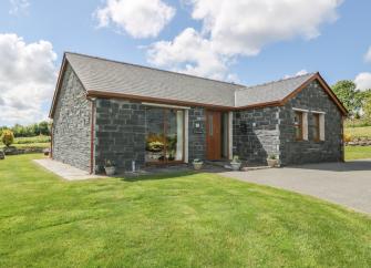 A stone built anglesey holiday home in open countryside.