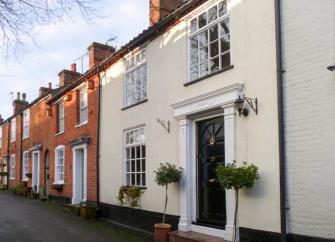 Exterior of an 18th-century terraced holiday cottage in Aylsham.