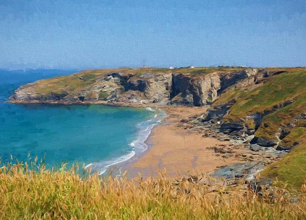 Clifftops over look a sandy beach and the sea.