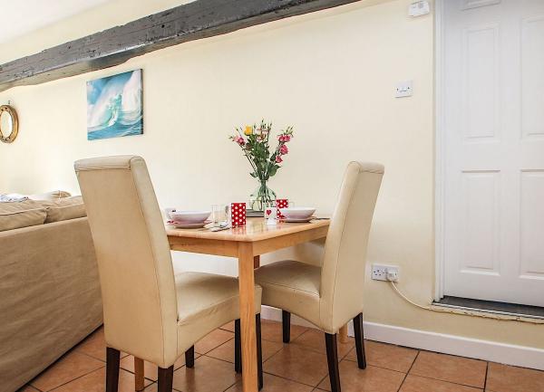A dining table and chairs for two people.