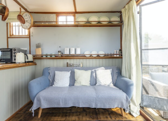 Open-plan living space in a converted horse box in Somerset.