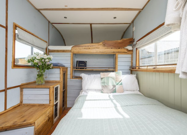 A cosy fold-away double bed in a Somerset Shepherds Hut