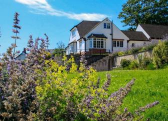 A large countryside Braunton holiday cottage with a large terrace and mature gardens.