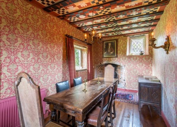 Eat in style in this oak floor and beamed dining room with antique oak table and chairs for 6.