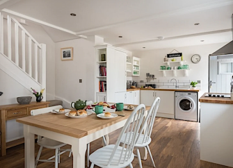 An open plan kitchen diner in a Cornish barn conversion.