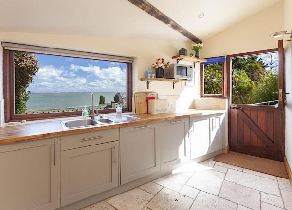 Pine-topped kitchen units in a coastal cottage in Porlock Wer.