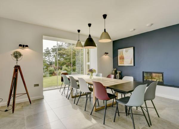 A dining area with a large dinner table seating 12.