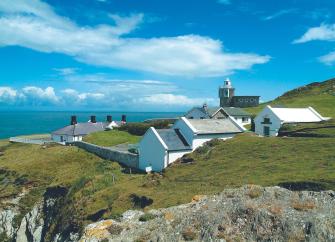 A lighthouse holiday cottage complex on a rugged North Devon clifftop.