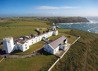 A Cornish lighthouse complex with holiday cottages in a clifftop location.