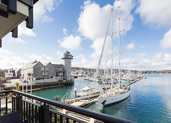 A Falmouth Marina view from the deck of a waterside holiday apartment.