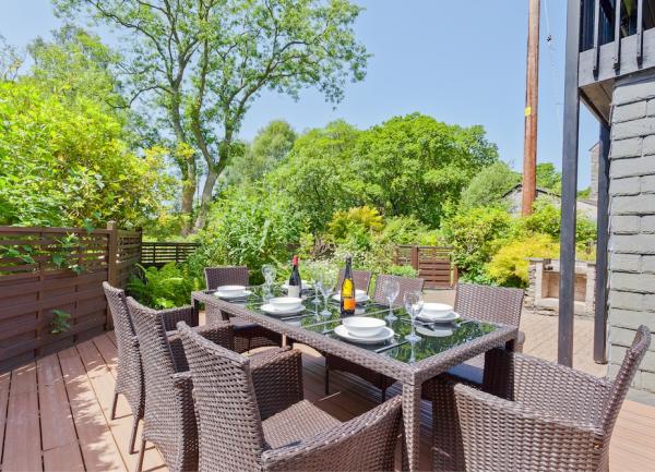 Garden deck with table laid for 6.