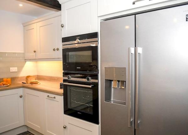 Kitchen fridge-freezer and oven.