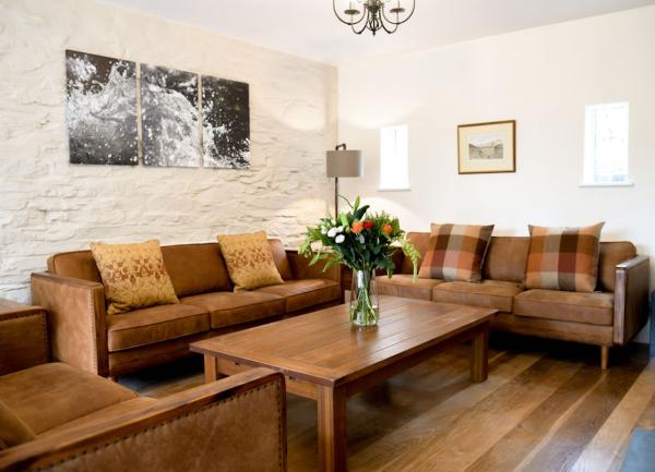 Lounge with leather sofas and large coffee table.