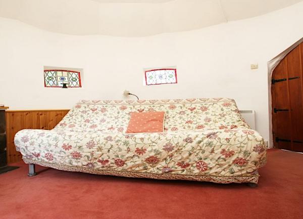 A floral-patterned sofa in a lounge.