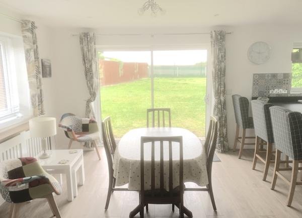 Dining room with table and four wooden chairs