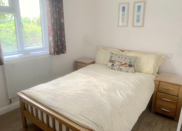 Double-bedroom with large window.