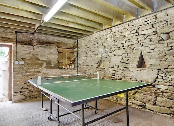A games Room with a full-size table tennis table.