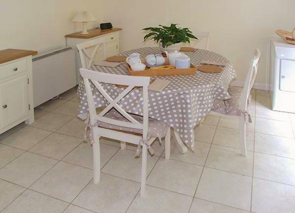 Litchen with fitted floor and wall cupboards, a full height fridge freezer and an integrated