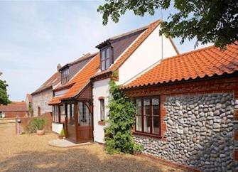 Stable Cottage, the front of a stone-built barn conversion.