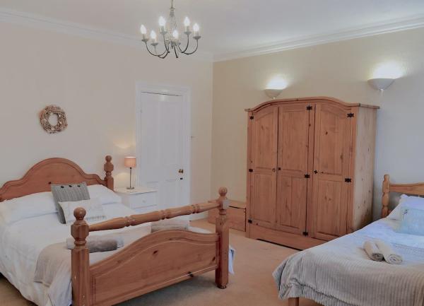 A. twin bedroom with beds and wardrobe.